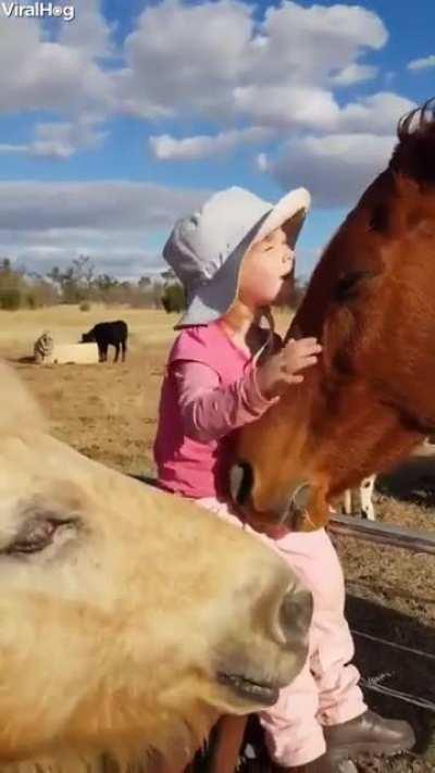 Little girl singing to her horse. We all started here. Originally posted in r/MadeMeSmile.