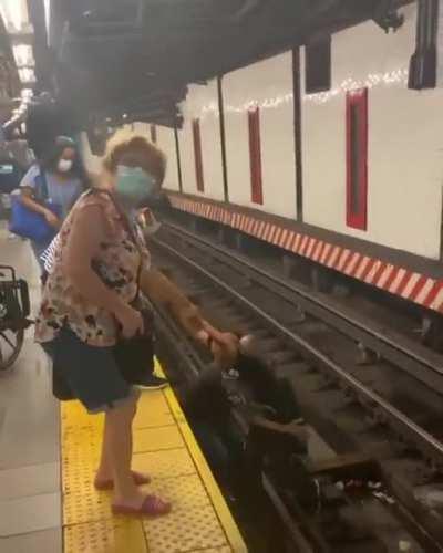 A HERO Just seconds before the train arrived, a good Samaritan jumped onto the tracks to save a man in a wheelchair