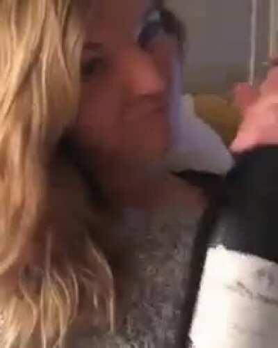WCGW licking a bottle of champagne