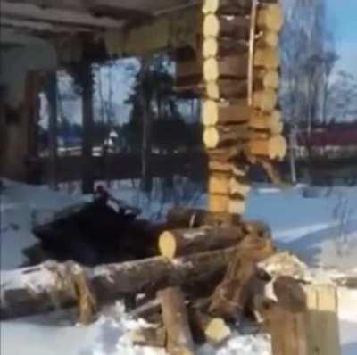 Standing under the structure while taking down a wall.