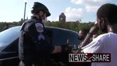 BLM protesters throws water after driver spit on them