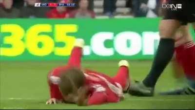 Soccer player got his shin slashed by the opponent's cleats.