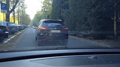 Blocking entire lane that's merging after 100m