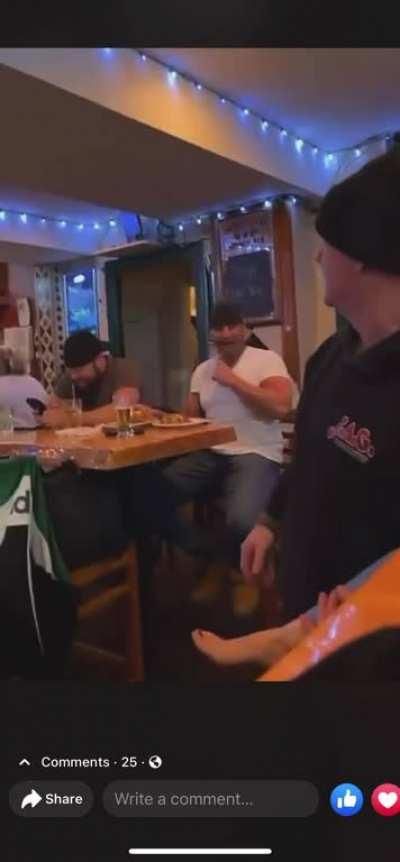 New Year’s Eve 2020, middle of a pandemic, young woman lets old guy with missing teeth suck on her toes and rub his saliva all over her feet, clothes and table.