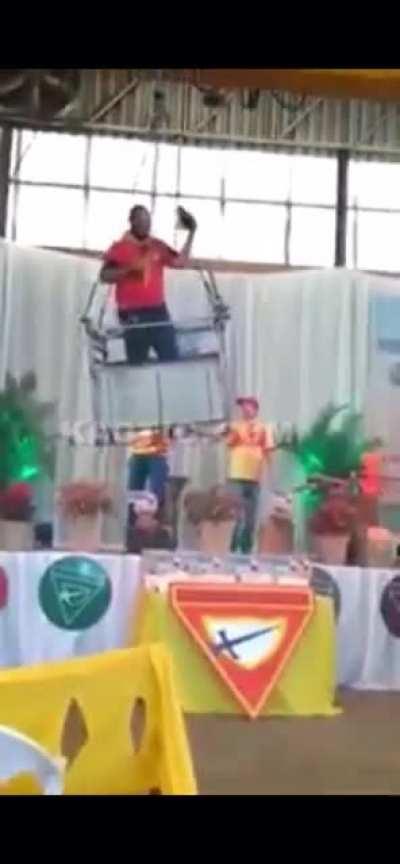 Pastor uses a crane during his church sermon. The latch fails on the platform sending him to the ground.