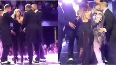 Held and spanked on stage