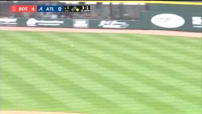 J.D. Martinez tries to go from first to third with Ronald Acuña Jr. manning right field.
