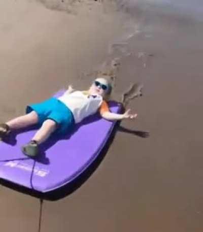 Kid chillin in the beach