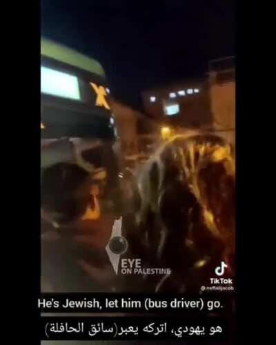 A group of Israelis attack a bus until they realize that the driver is a Jew