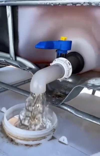 Draining glyphosate into a container looks fake!