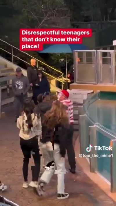 Teens interrupting a mime