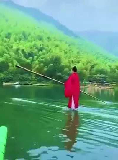 Paddling on a bamboo with a bamboo