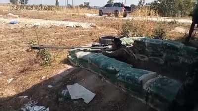 KNLA soldier shooting at the Myanmar Army position with a locally built anti-materiel rifle.