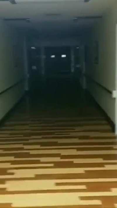 Ghost in hospital peeks out at me as I walk by