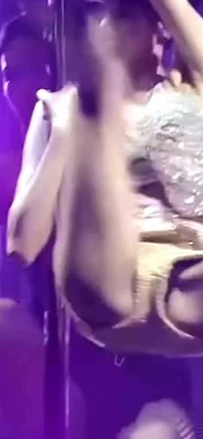 Lisa spreading her legs while pole dancing