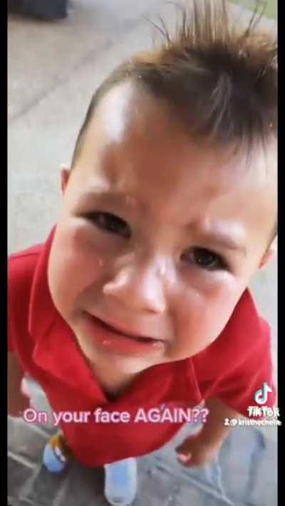 Kid pees on his own face.