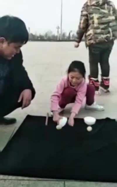 Her hand is quicker than my eye.