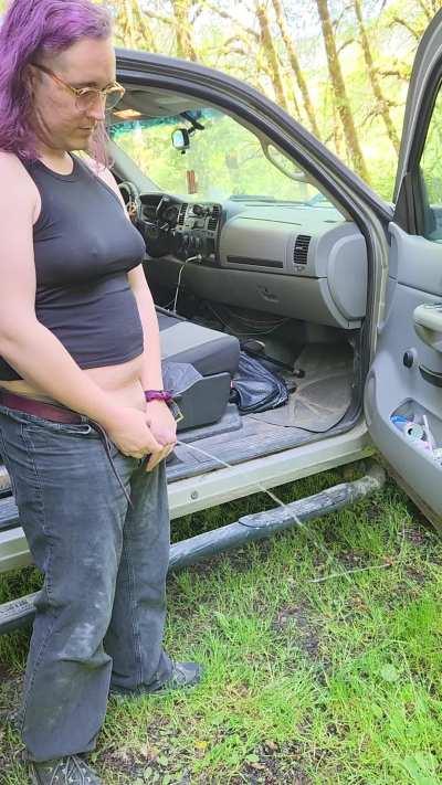 Trans girl pissing on the side of the road