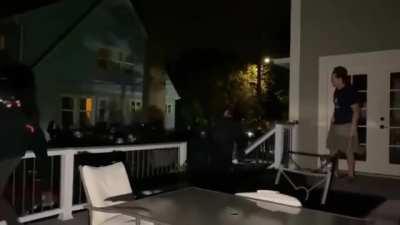 Protestors in South East Portland run onto people's property to hide from cops. One homeowner goes out and tells them to get out.