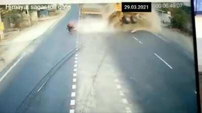 Reckless Biker Causes Two Trucks To Crash