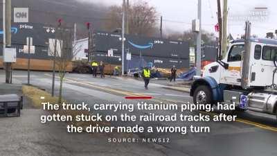 Train wins argument against truck, causes big mess