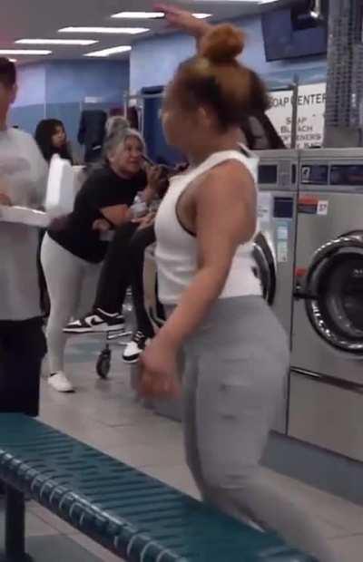 Kid pretends to be stuck in washing machine for content