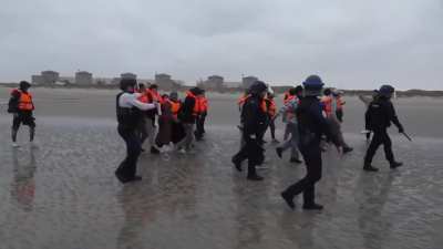 French police use pepper spray on migrants trying to cross English Channel
