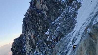 Climber trapped in the middle of a rock collapse on Mont Blanc. The climber was rescued later by helicopter.
