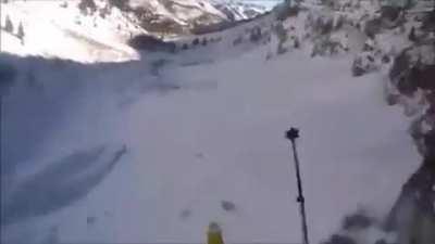 Skier accidentally goes off a cliff, luckily lands in powder