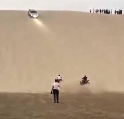 Idiots on a sand dune.