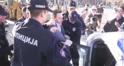 Serbian government media is trying to censor a video of a journalist arrested today for opposing the government