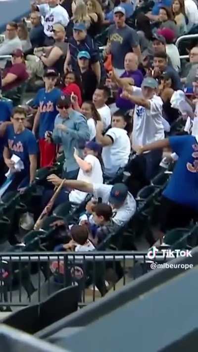 Dad saves his sons from a flying baseball bat with not a drop of beer spilled.