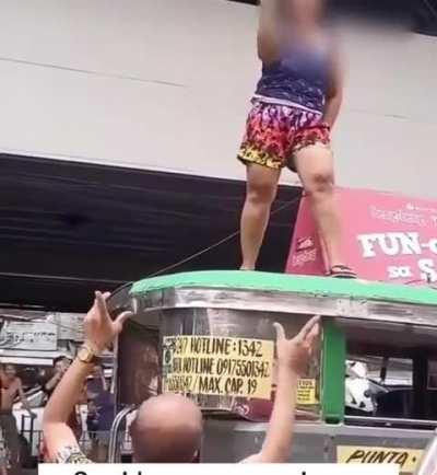 Woman dancing on top of a vehicle