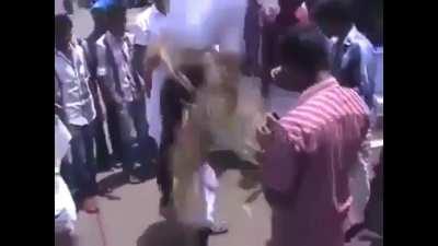 Using Petrol to light a protest effigy