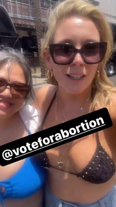 Kulap and June walking in bikini tops