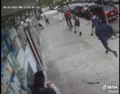 Bicyclist punches elderly woman and knocks her down is caught by firefighters.