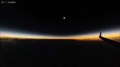 solar eclipse occurring during a flight