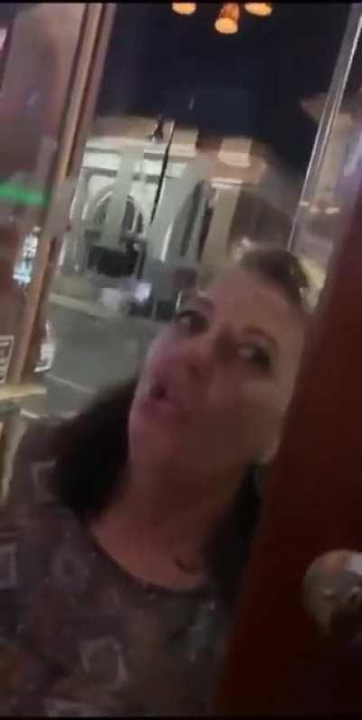 angry monster zombie attacks people in a bar.