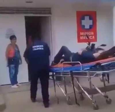 WCGW pulling the stretcher with one hand