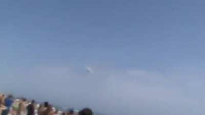 Fighter jet breaking the sound barrier in public