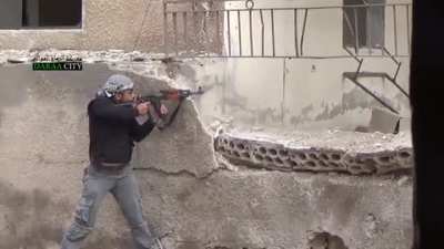 Close call incoming fire as FSA clash with SAA in Dar'a al-Balad, Syria (2013)