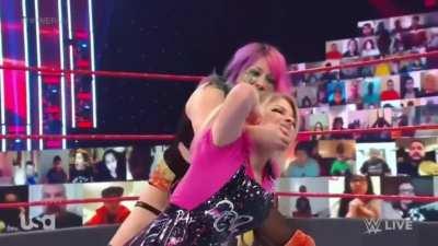 Asuka puts Alexa in a chicken wing submission hold