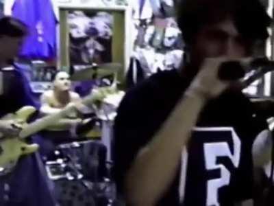 Zed's Records was a record store in a strip mall near a busy traffic circle best known for bringing punk music to SoCal. In March 1992, the band Rage Against the Machine with a 22-year-old Zach De La Rocha plays live to a crowd of fans. Eight months later