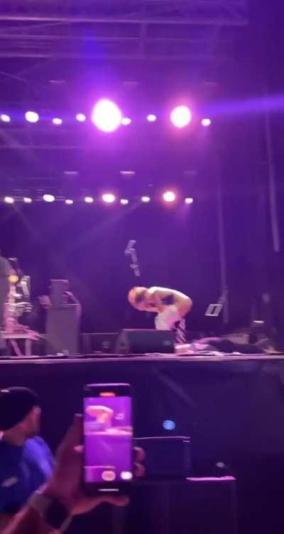 Pissing on a fan on stage