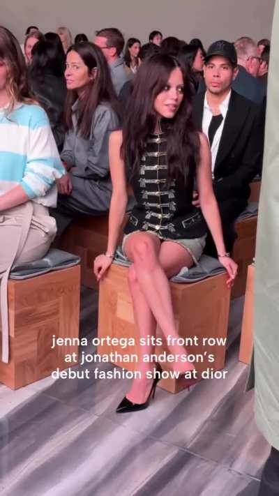 Sitting at the Dior Fashion Week
