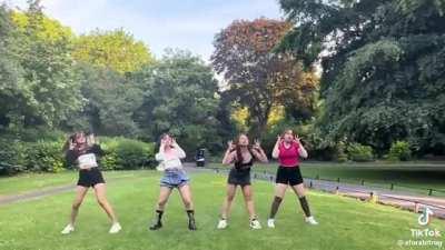 Man shouts at girls making a Tik Tok video in park