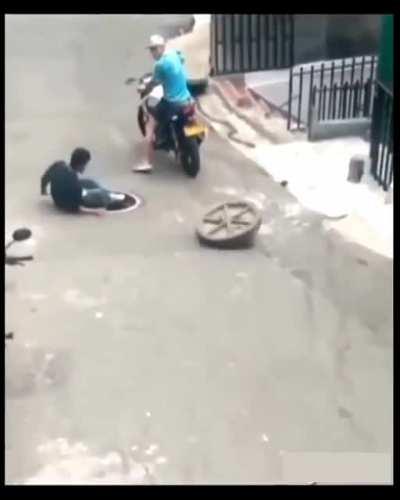 Trying to steal Manhole cover!