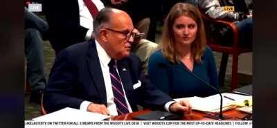 Rudy Giuliani just farted in court and the poor lady next to him heard it.