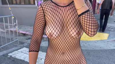 Wearing only a fishnet dress in public