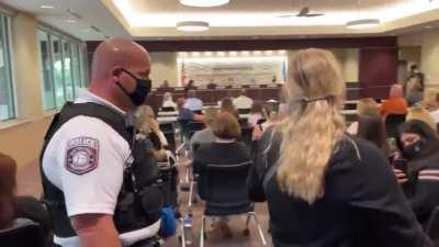 Woman makes a scene while being escorted from Jenks School Board meeting where mask mandate was instated.